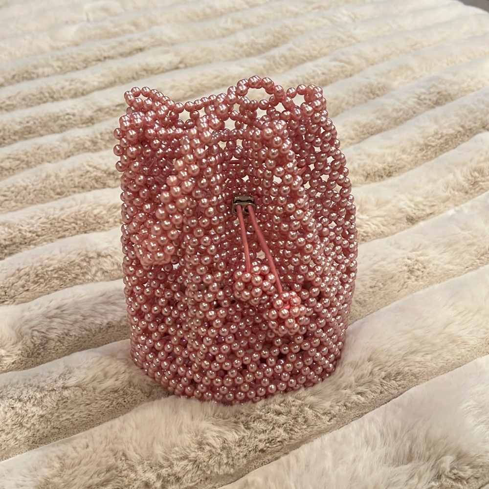 Little fancy bag made with pink pearls.